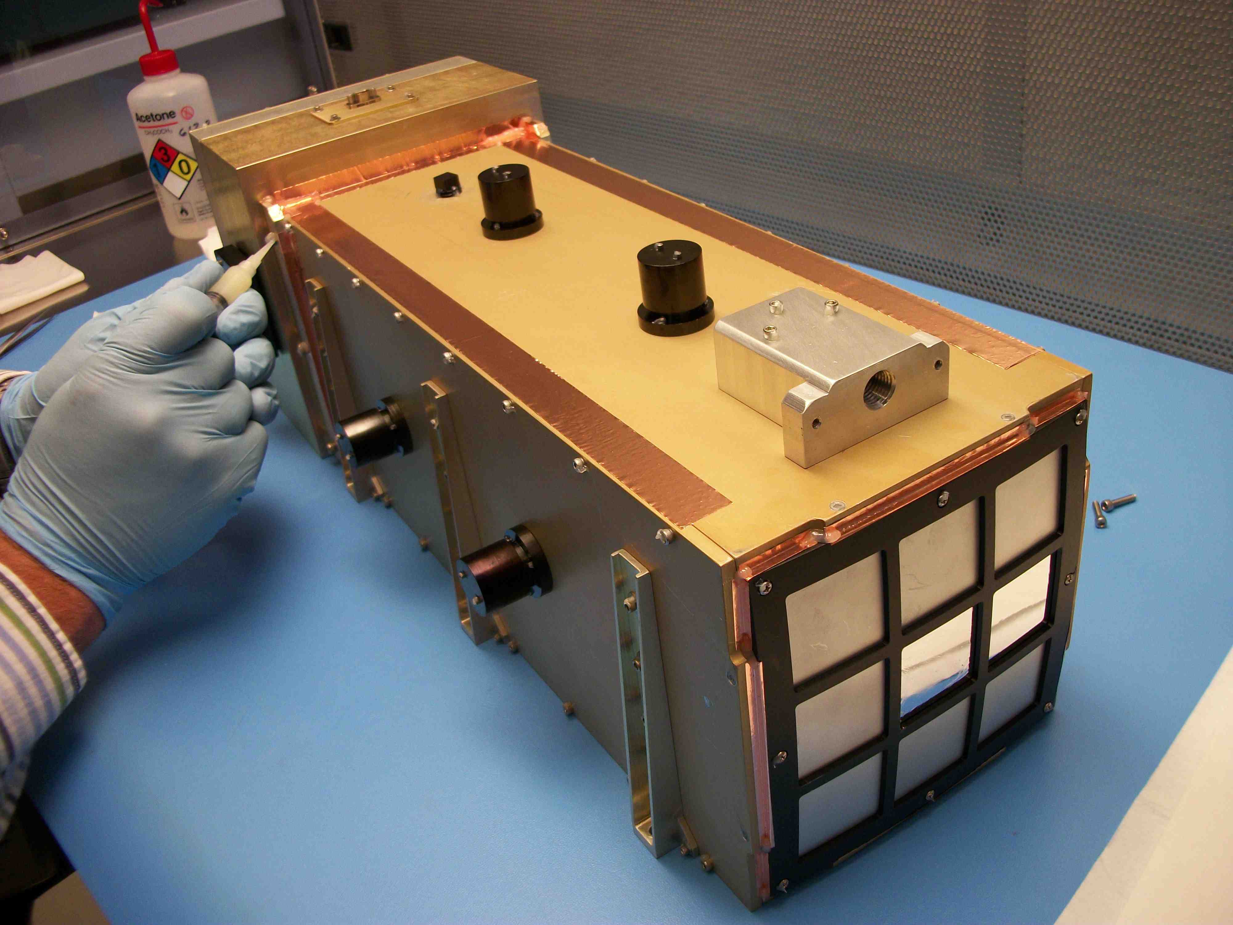 The integrated instrument prototype with the optics assembly at the front and the electronics box in the back. Credit-NASA