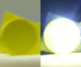  Photograph of bright white light (right) achieved using lasers in combination with phosphors next to an image of the phosphor with no illumination.
