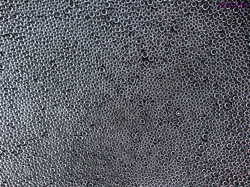 This still image shows droplets that have formed on a biphilic surface at 75 percent humidity and 269 degrees Kelvin. As the droplets coalescence some drops become larger, and the placement of the drops becomes more disordered.  Credit: Amy Betz/Kansas State University