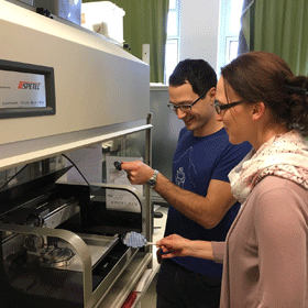 Christina Schindler and Bernhard Huber in front of their inkjet printer in the laboratory. <br/>CREDIT: Huber et al.