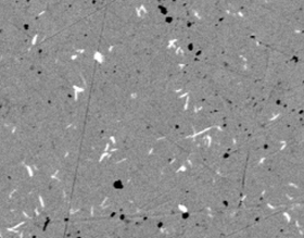 The multi-phase thermoelectric Cu(1.97)Ag(0.03)Se consists of a main crystal structure of Cu(2)Se and an impurity phase with the crystal structure of CuAgSe. In this scanning electron microscope image the impurity phase shows up as light spots. The dark spots are voids in the crystal structure.