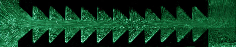 When a fluid is squeezed and expanded repeatedly between two sawtooth-like boundaries, a net flow is generated to the right.