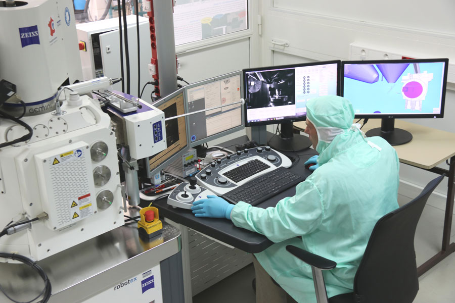 A researcher at the Femto-ST Institute in Besançon, France, assembles microrobotic systems using new optical nanotechnologies.  CREDIT: FEMTO-ST Institute