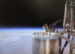 In-flight video still from BOBCAT during liquid helium transfer at an altitude of 130,000 feet. CREDIT: NASA