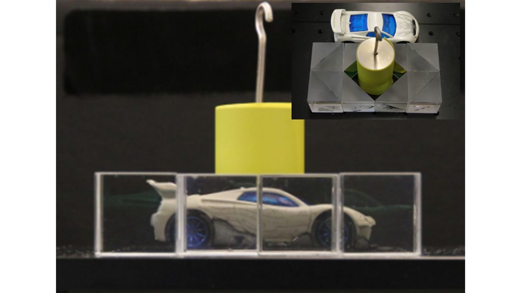 Cloaking device realized by standard optical components. Figure reproduced with permission from Sci. Rep. 6, 38965 (2016) Copyright 2016 Springer Nature Limited 