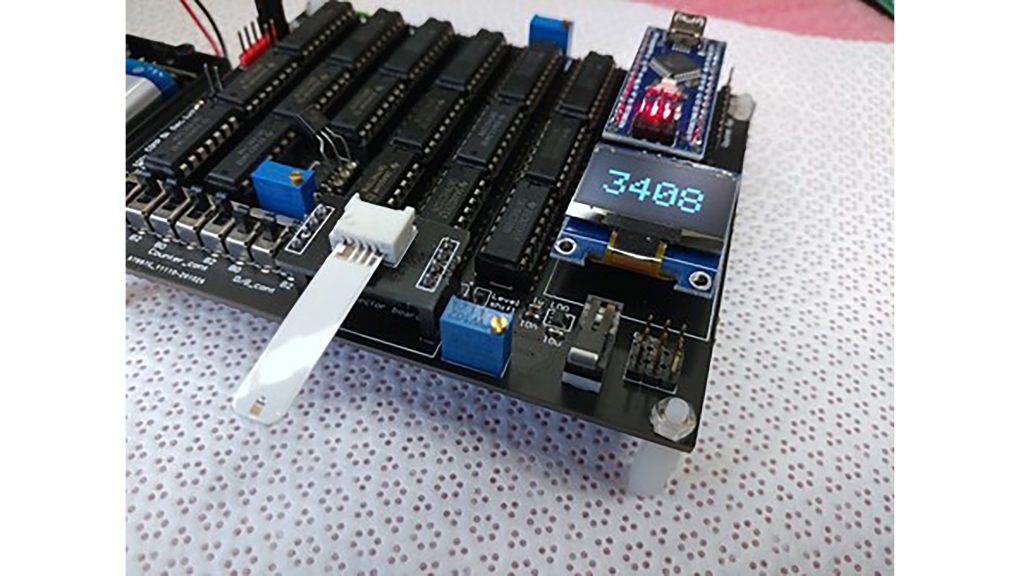 Cerebrospinal fluid detection in action showing inserted sensor strip and 4-digit readout. CREDIT: Minghan Xian, Chan-Wen Chiu, Patrick Carey, Chaker Fares, Liya Chen, Rena Wu, Fan Ren, Cheng-Tse Tsai, Siang-Sin Shan, Yu-Te Liao, Josephine F Esquivel-Upshaw, Stephen J. Pearton