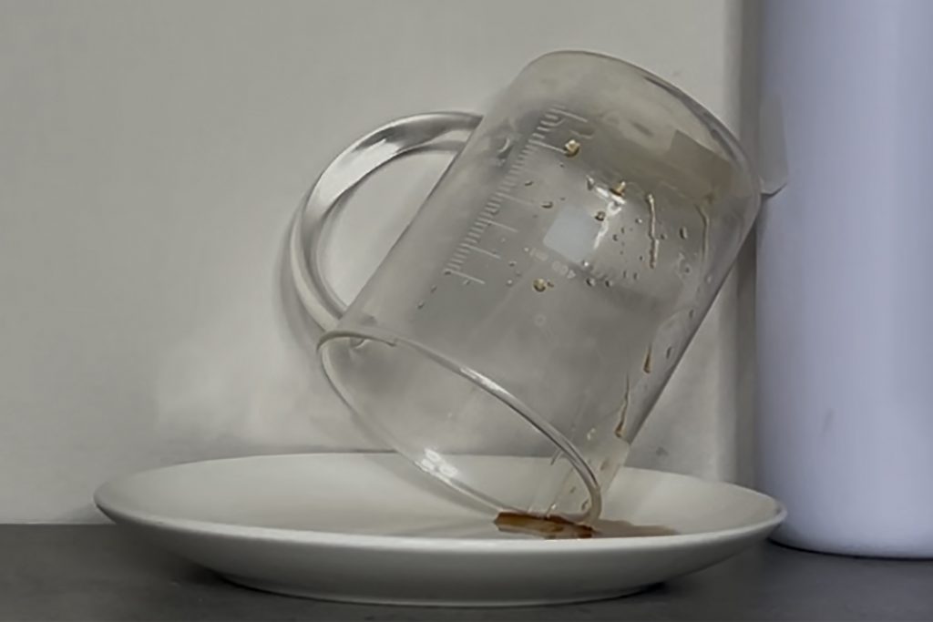 Syrup being tipped out of a beaker for measurement. Credit: Thomas Dutta