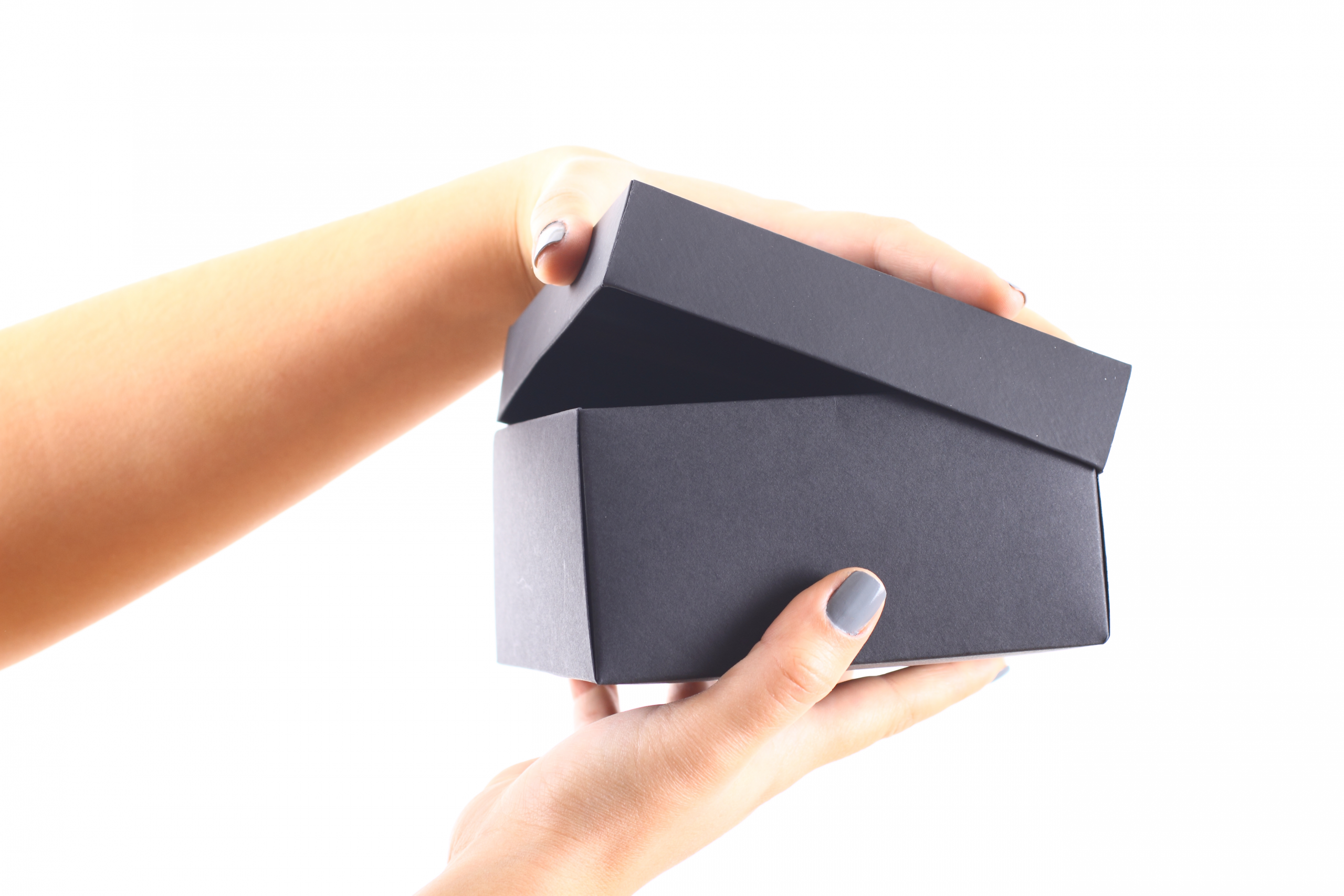 Hands opening a black box symbolizing transparency in AIPP’s peer review process